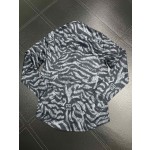 Givenchy full body tiger print paired with the latest quirky pumpkin head bird print