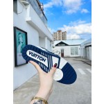 Louis Vuitton with four leaf clover pattern on the side of the shoe