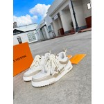 Louis Vuitton with four leaf clover pattern on the side of the shoe