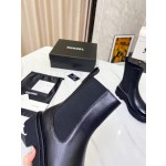 CHANEL puts on his boots with one foot