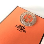 Hermes brooch